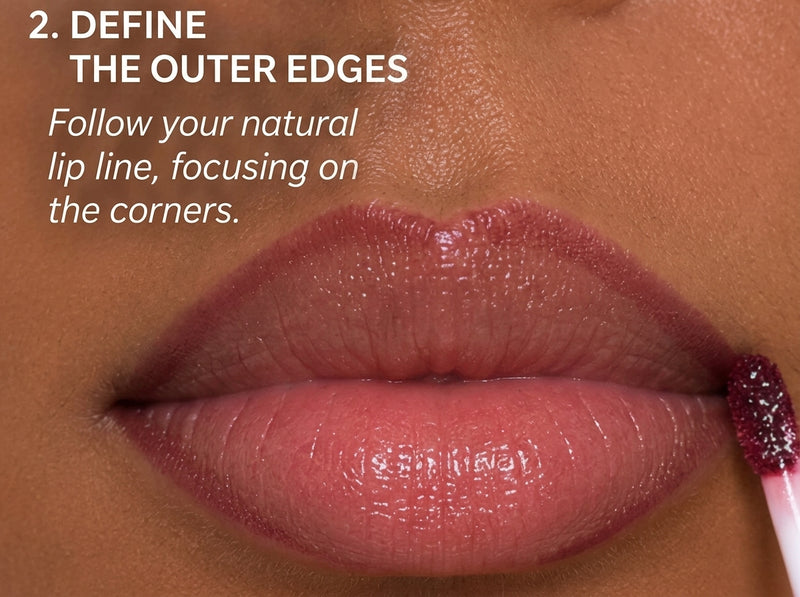Model shaping outer corners and lower lip with white and silver lip liner